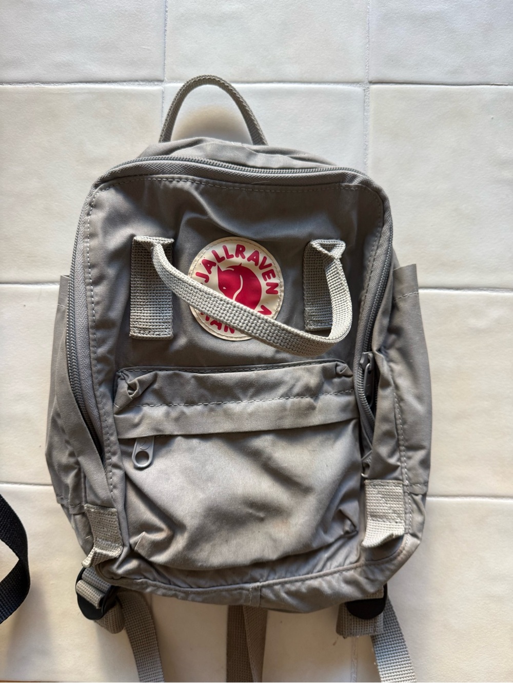 Fjallraven Kanken Mini Backpack in Light Gray with Red Logo